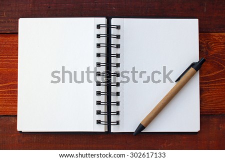 Blank Notebook and Pencil