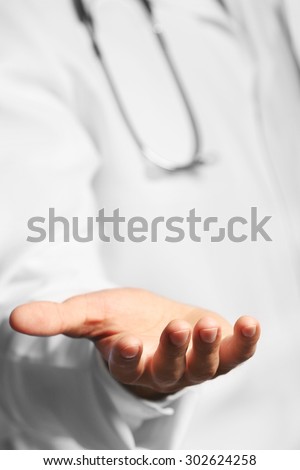 Doctor holding something, closeup