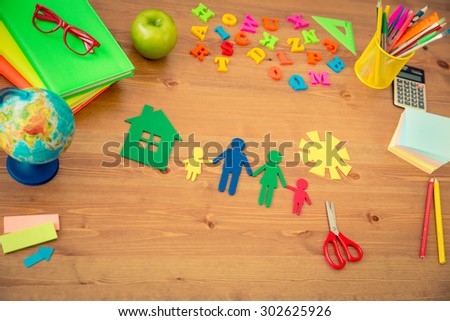 School items on wooden desk in class. Education concept. Top view