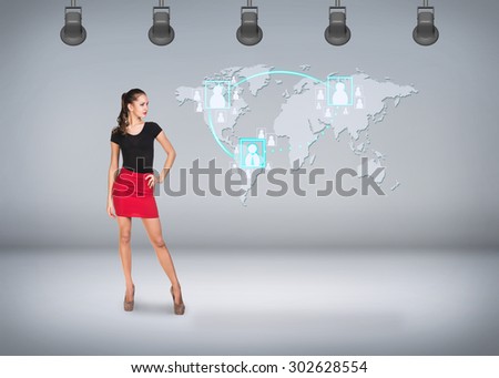 Young businesswoman on the background of world map. Elements of this image furnished by NASA