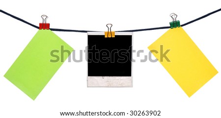 color notes and  instant photo on a rope isolated on white