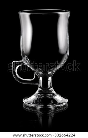 Glass cup for coffee or coctail on black background
