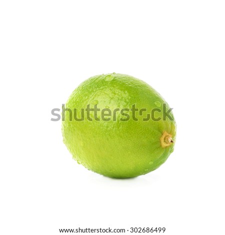 Lime green fruit covered with the multiple water drops, isolated over the white background