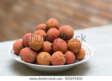 Famous tropical fruit - lychee - fresh and sweet on the table