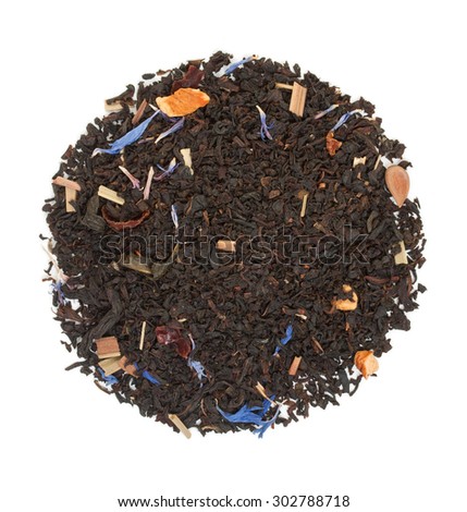 Black tea with pieces of dried fruit and hibiscus flowers isolated on white top view