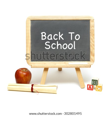 A blank chalkboard with other school items for displaying your message.