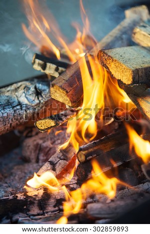 wooden bonfire on bbq as background