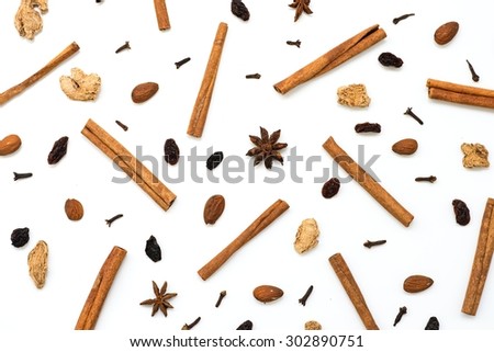 Mulled wine ingredients (cinnamon, anise, raisins, ginger, cloves), top view Royalty-Free Stock Photo #302890751