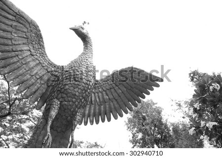 black and white figure peacock gold Statue Winged in garden