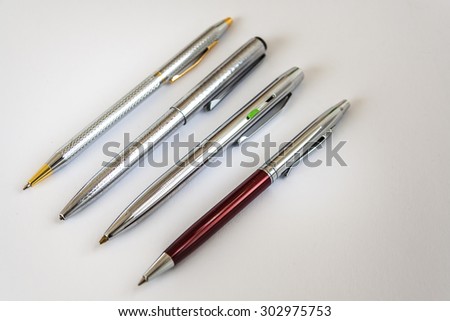 Four Ballpoint Pens On White Background