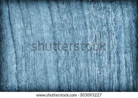 Photograph of Bleached and Dark Blue Stained Walnut Wood vignette grunge surface texture.