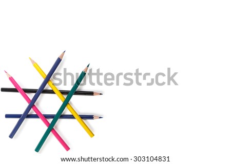 a set of children's colored pencils lying on a white background