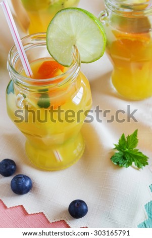 orange soft drink with fruit on the table. top view. health and diet food. selective focus