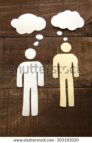 Two paper man thinking illustration on wood background