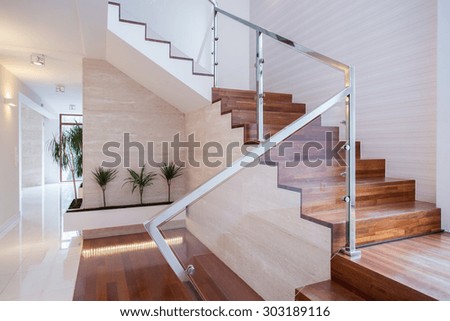 Image of stylish staircase in bright house interior Royalty-Free Stock Photo #303189116