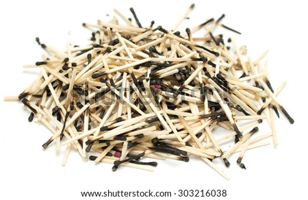 pile of burnt matches on a white background