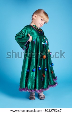 cute little girl with christmas tree dress