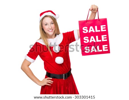 Xmas girl hold shopping bag with three sale word