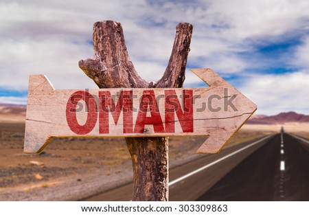 Oman sign with desert road background