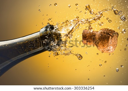 Opening a bottle of champagne. Celebration concept. Royalty-Free Stock Photo #303336254