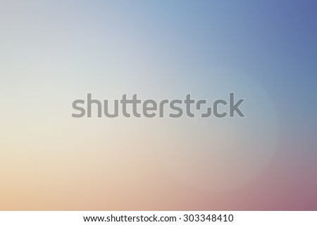 abstract blurred beautiful pastel color of sunset beach with lens flare effect background.