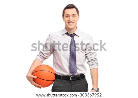 Handsome businessman holding a basketball isolated on white background
