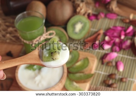 Yogurt white with green kiwi fruit and kiwi juice