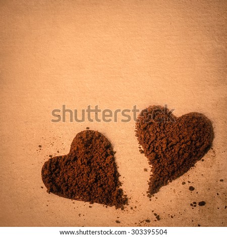 coffee in heart shape on the old paper texture