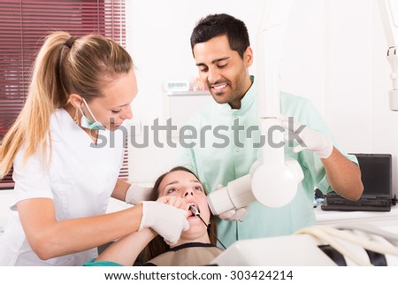 adult russian woman patient checking the teeth an digital xray  