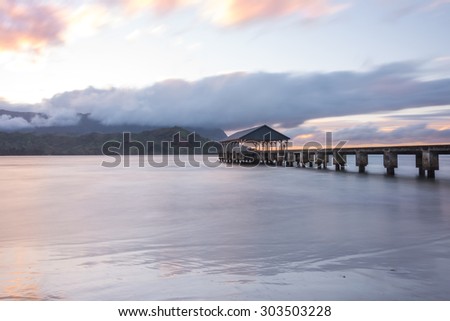 Hanalei Pier in Hanalei Bay on the north shore of Kauai, Hawaii Royalty-Free Stock Photo #303503228