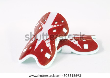 Shinguards is a device used to prevent accidental athlete in competitive soccer Royalty-Free Stock Photo #303518693