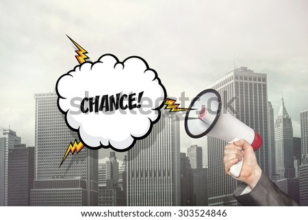 Chance text on speech bubble and businessman hand holding megaphone on cityscape background