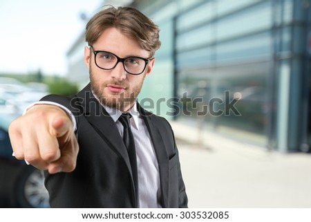 Handsome young businessman attracting your attention