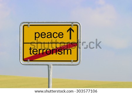 Yellow town sign with text "peace terrorism"