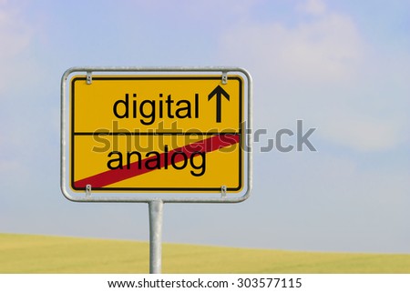 Yellow town sign with text "digital analog"