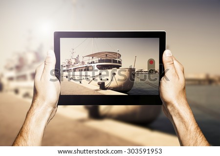 Taking photos with a digital electronic tablet