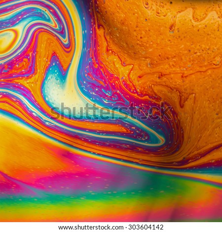 Psychedelic patterns formed on the surface of soap bubbles