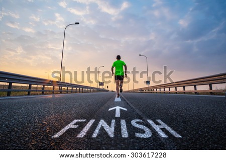 Run to the finish line Royalty-Free Stock Photo #303617228