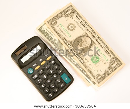 the calculator lying near dollars
