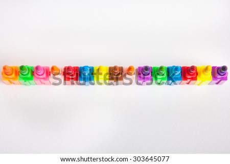 Multicolored crayons on a white paper background.