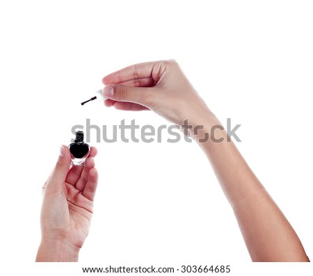 Black nail polish in female hands isolated on white background