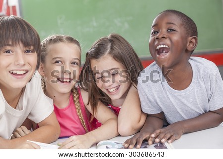 pupils laughing togethers Royalty-Free Stock Photo #303686543