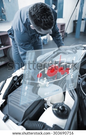 Engine interface against mechanic using laptop on car
