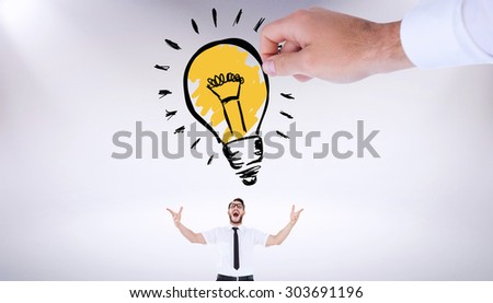 Hand drawing light bulb against grey background