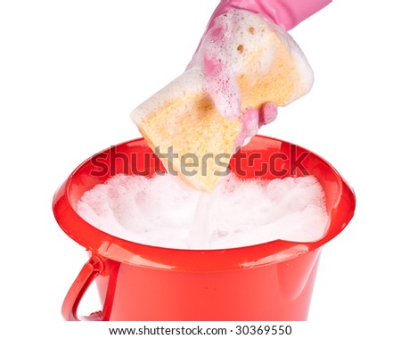 Household sponge in a hand on a white background