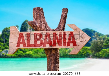 Albania wooden sign with beach background
