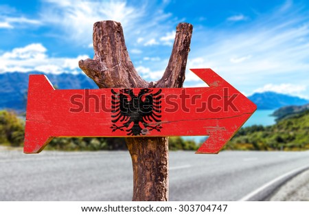 Albania Flag wooden sign with road background