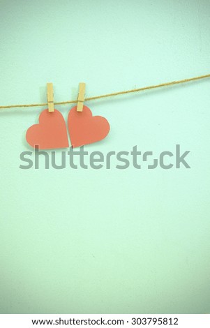 Hearts and clothe pins , vignetting and vintage tone ,  space for text copy