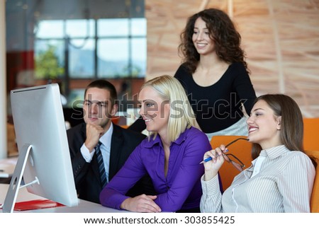 Group of happy young business people in a meeting