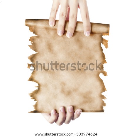 Hand holding a folded roll of old paper (letter or invitation to a party). Subject halloween.